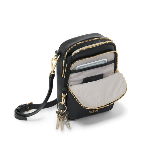 front pockets of black/gold TUMI Voyageur Kendal Leather Crossbody