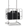 Black Samsonite bag in a metal stand on a white background