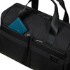 Black Samsonite duffel bag with compartments and a blue wallet inside on a white background