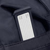 Close-up of a Samsonite  bag with a name tag inside