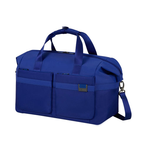 Blue Samsonite duffel bag with handles and a shoulder strap on a white background