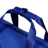 Close-up of a blue Samsonite bag with a strap on a white background