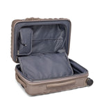 Open beige TUMI suitcase on a white background