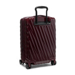 Maroon TUMI suitcase with black handle on a white background