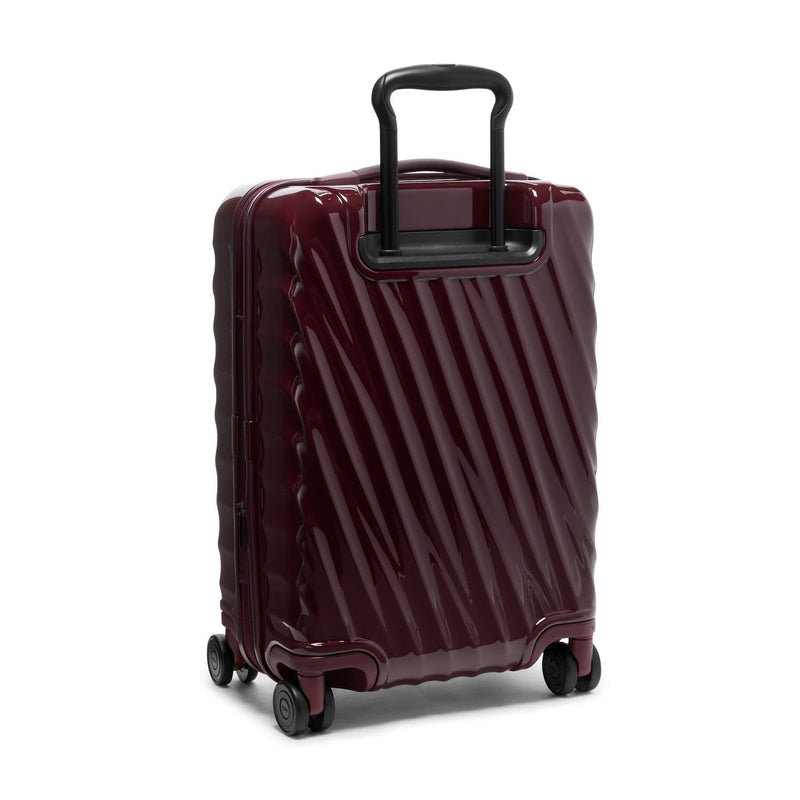 Maroon TUMI suitcase with black handle on a white background