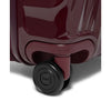 Close-up of a maroon TUMI suitcase with a visible logo on a white background