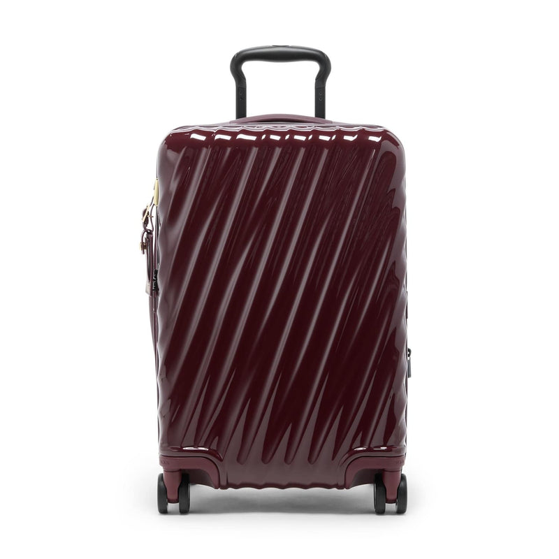 Maroon TUMI suitcase with diagonal stripes on a white background