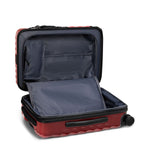 Red TUMI suitcase with open lid on a white background