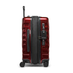 Red TUMI suitcase with black accents on a white background