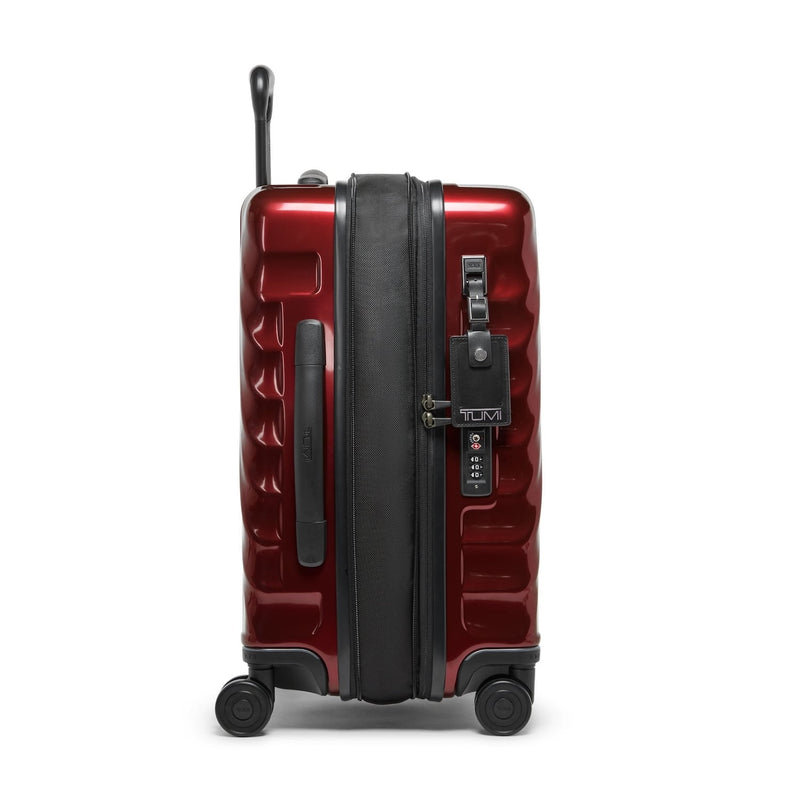Red TUMI suitcase with black accents on a white background