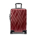 Red TUMI suitcase with black handle and wheels on a white background