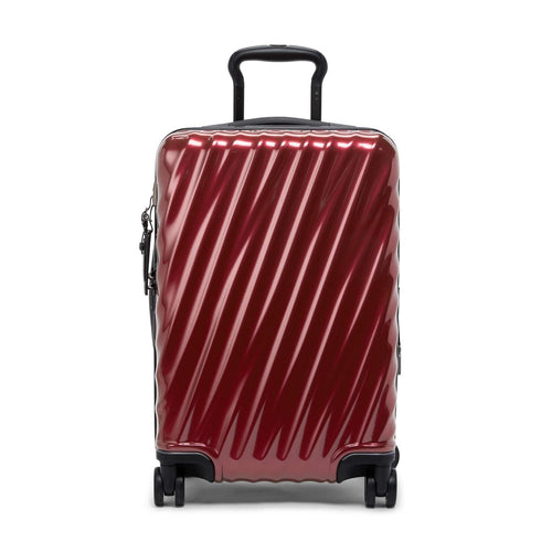 Red TUMI suitcase with black handle and wheels on a white background