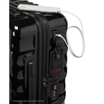 Black TUMI suitcase with a power bank attached on a white background