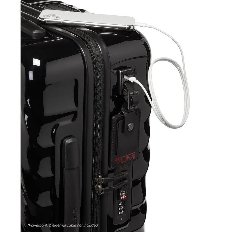 Black TUMI suitcase with a power bank attached on a white background