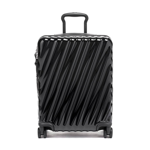 Black TUMI suitcase with a striped pattern on a white background