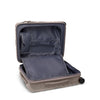 Open beige TUMI suitcase with dark interior on a white background