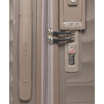 Close-up of a TUMI suitcase with a zipper and combination lock on a white background