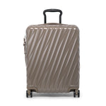 Beige TUMI suitcase with a textured pattern on a white background