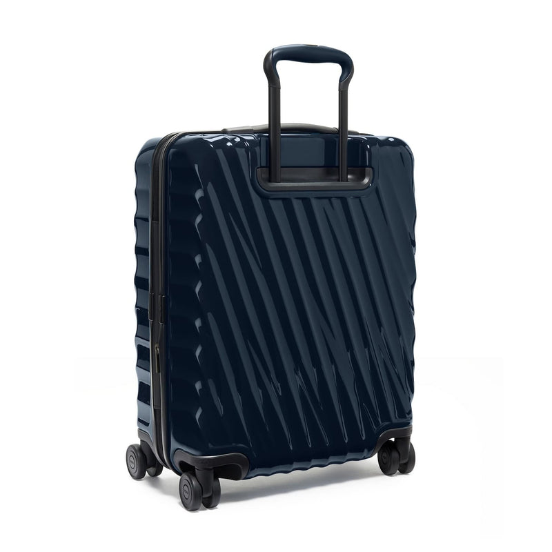 Navy TUMI suitcase with a black handle on a white background