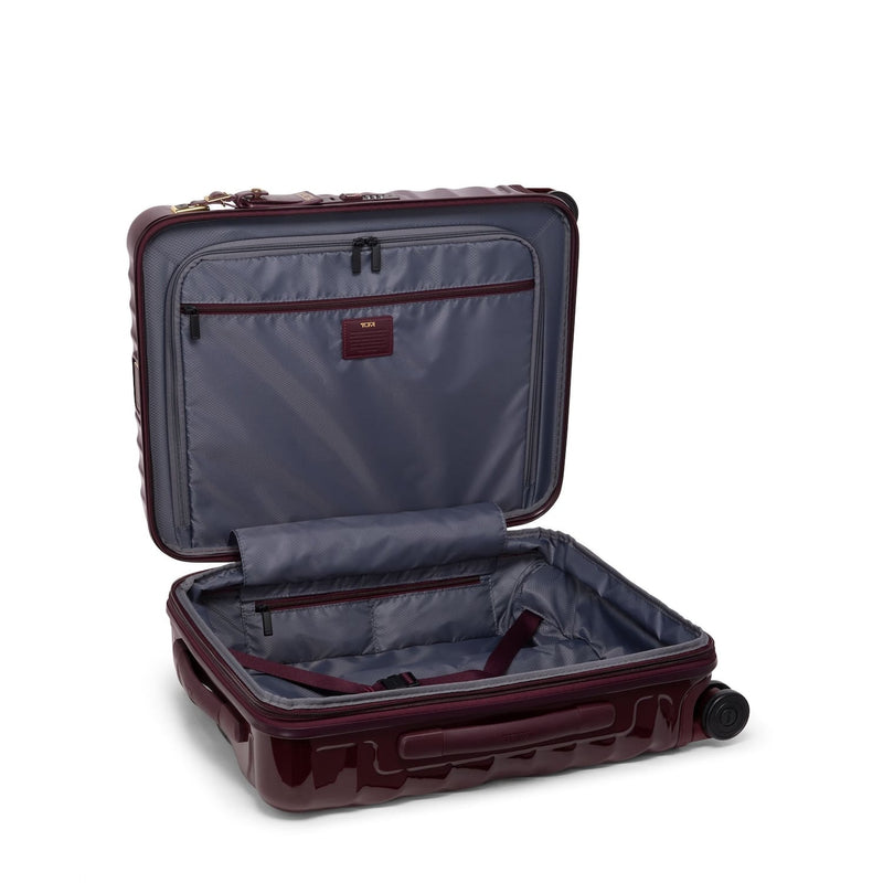 Open maroon TUMI suitcase on a white background