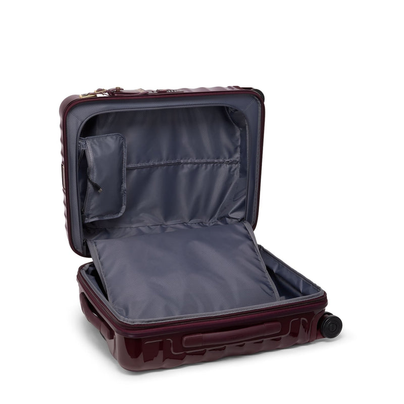 Open burgundy TUMI suitcase on a white background