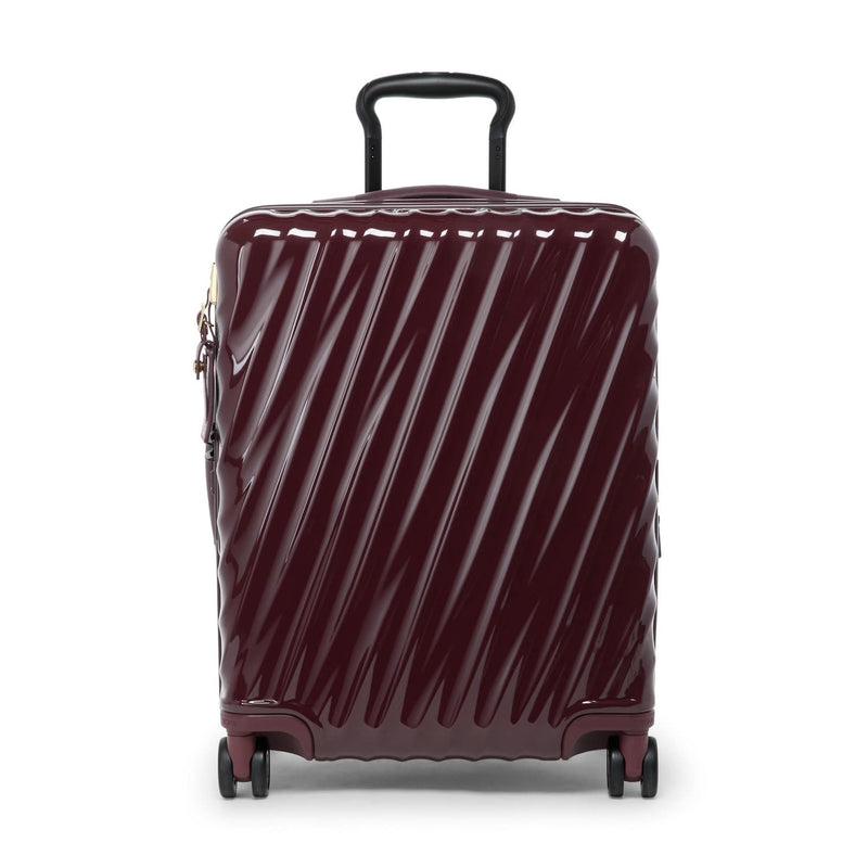 Maroon TUMI suitcase with diagonal stripes on a white background