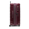 Maroon TUMI suitcase with wheels and handle on a white background