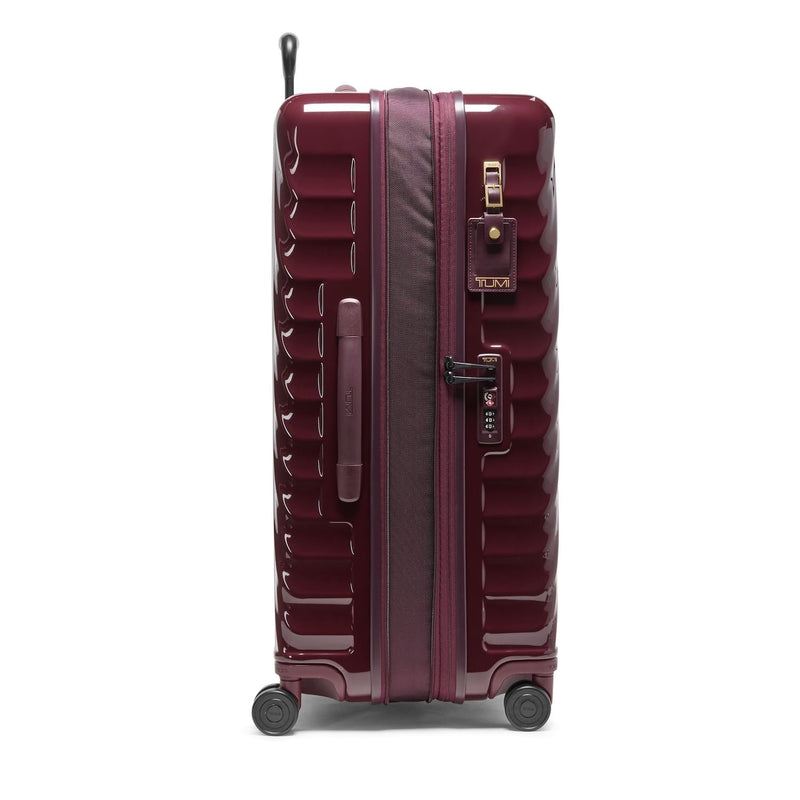 Maroon TUMI suitcase with wheels and handle on a white background