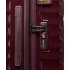 Maroon TUMI suitcase with lock on a white background
