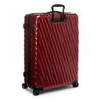 Red TUMI suitcase with black handle and wheels on a white background