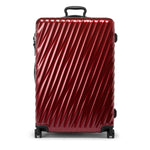 Red TUMI suitcase on a white background