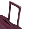 Close-up of a maroon suitcase handle with 'American Tourister' branding on a white background