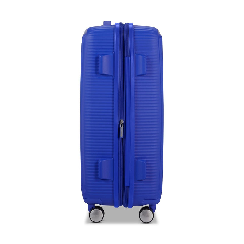 side of cobalt blue American Tourister Curio Spinner Medium Expandable