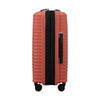 Clay Samsonite suitcase with black accents on a white background