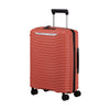Clay Samsonite suitcase with a black handle on a white background