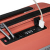 Close-up of a clay Samsonite suitcase with a USB port