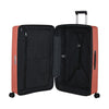 Open clay Samsonite suitcase with black interior on a white background
