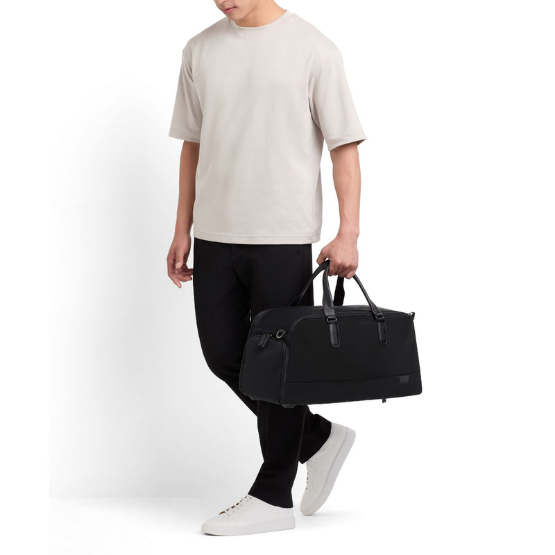 model with of black TUMI Harrison Port Weekend Duffle