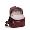 Wine TUMI backpack with open front pocket on a white background