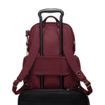 Wine TUMI backpack on a white background