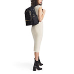 model with black/gold TUMI Voyageur Celina Backpack