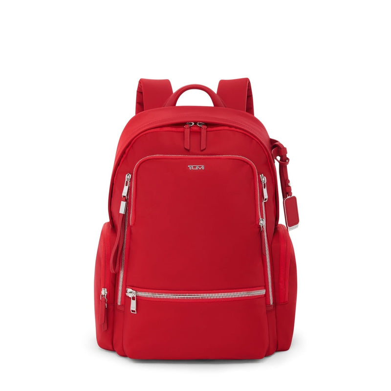 Red TUMI backpack with silver hardware on white background