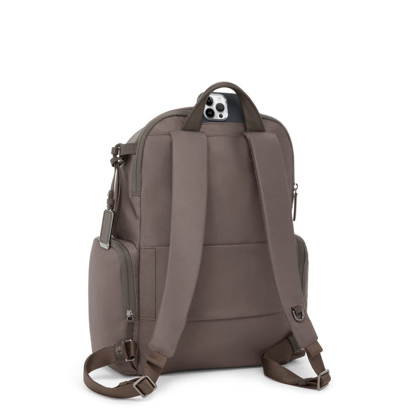 Back view of a Mink TUMI backpack on a white background