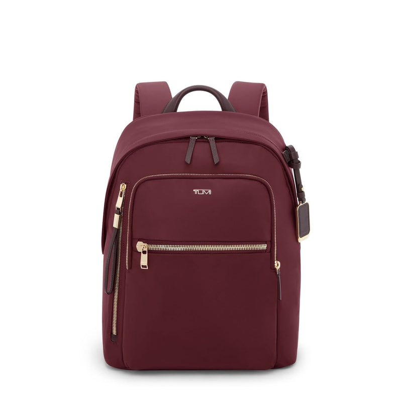 Wine TUMI backpack with gold zippers on a white background