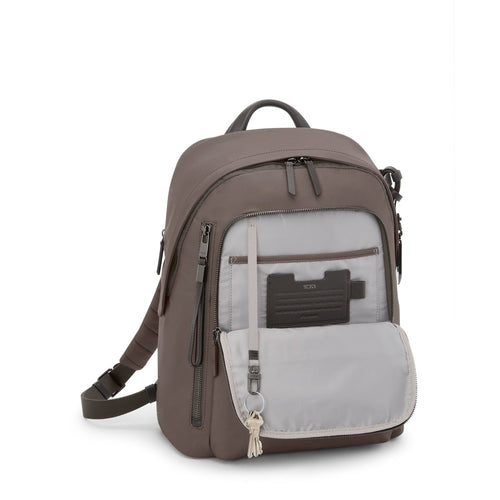 Mink TUMI backpack with multiple pockets on a white background