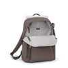 Mink TUMI backpack with a white compartment on a white background
