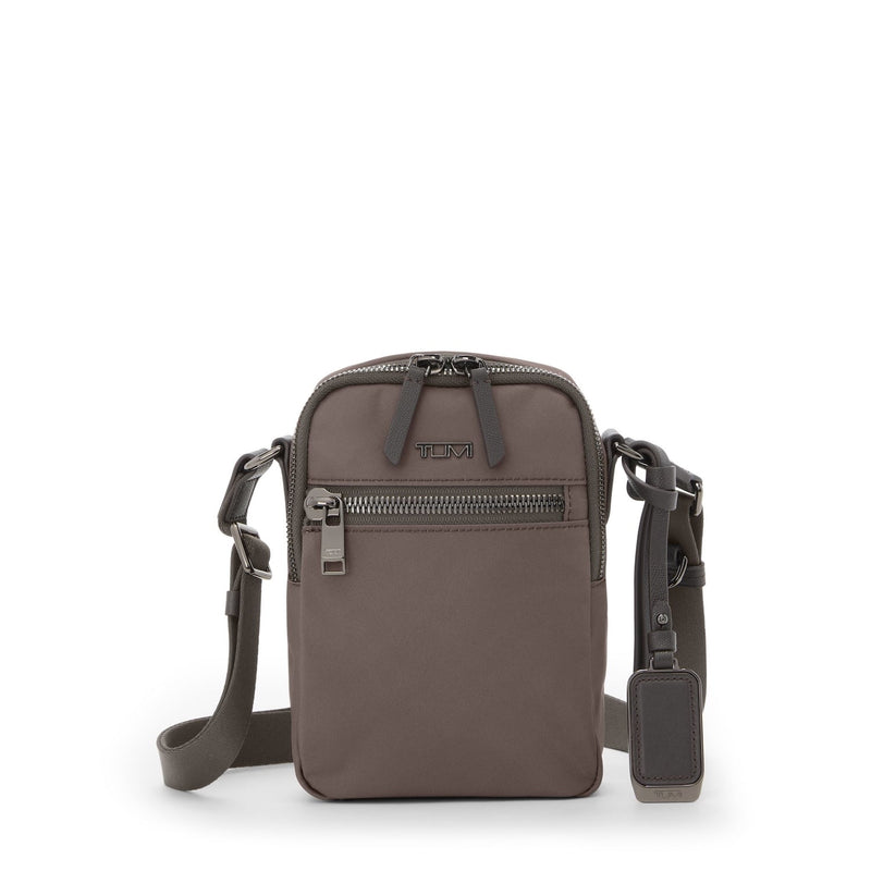 Mink TUMI crossbody bag with visible brand logo on a white background