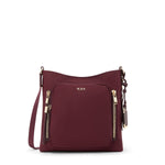 Wine TUMI handbag with gold zippers on a white background