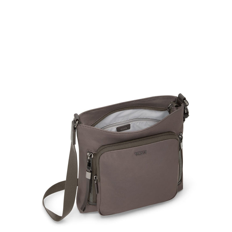 Mink TUMI shoulder bag with a strap on a white background