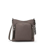 Mink TUMI shoulder bag with multiple zippers on a white background
